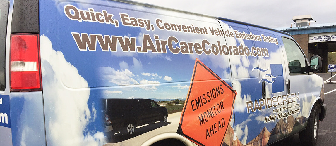 The rapid screen van advertising quick, easy, convenient vehical emissions testings with a emissions monitor ahead.