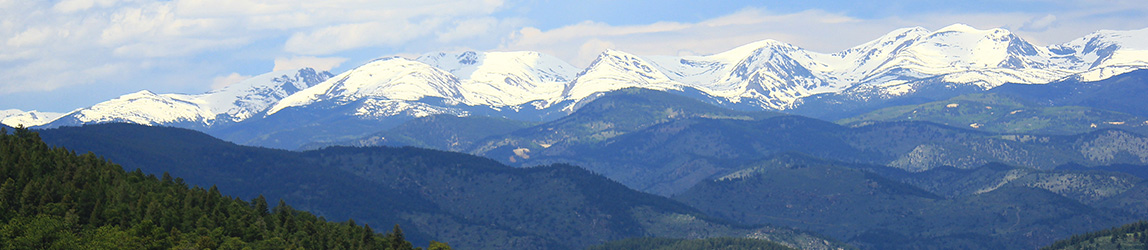 Looking out at snow covered Rocky mountains from the front range.